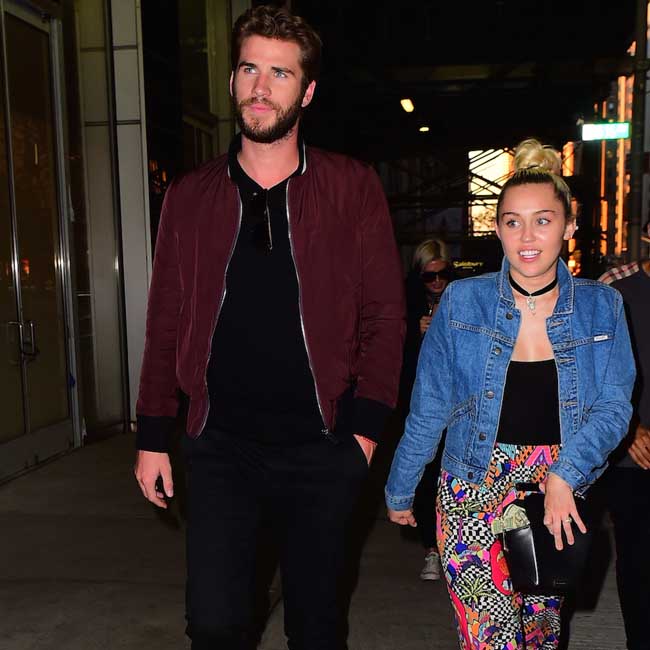 Liam Hemsworth and Miley Cyrus. Liam Hemsworth and Miley Cyrus.
