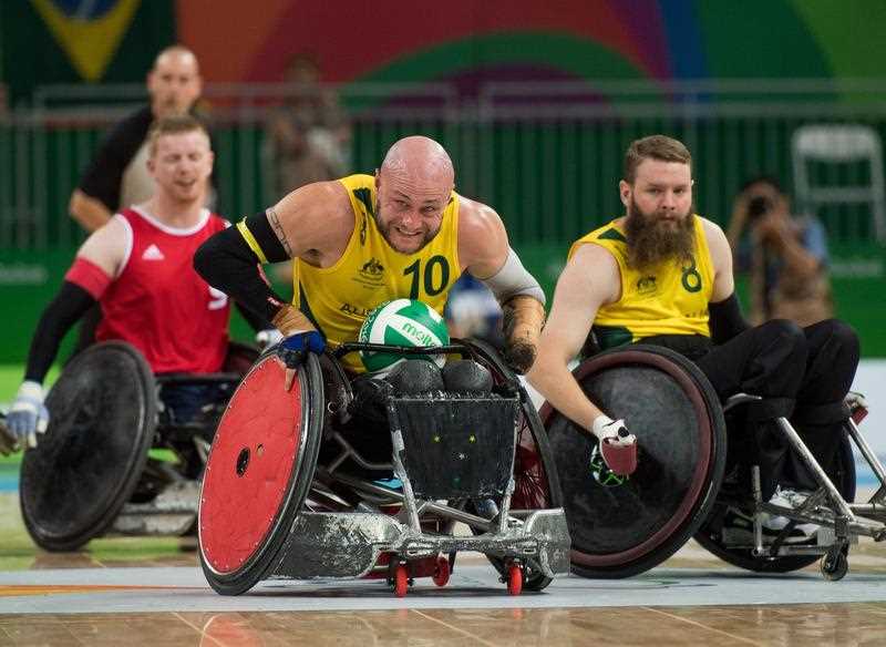 Chris Bond of Australia charges up the centre of the pitch during the Mixed - Pool Phase Group A, Wheelchair Rugby Match Australia vs Britain at the Carioca Arena 1 at the Rio 2016 Paralympic Games in Rio de Janeiro, Brazil, 14 September 2016. Chris Bond of Australia charges up the centre of the pitch during the Mixed - Pool Phase Group A, Wheelchair Rugby Match Australia vs Britain at the Carioca Arena 1 at the Rio 2016 Paralympic Games in Rio de Janeiro, Brazil, 14 September 2016.