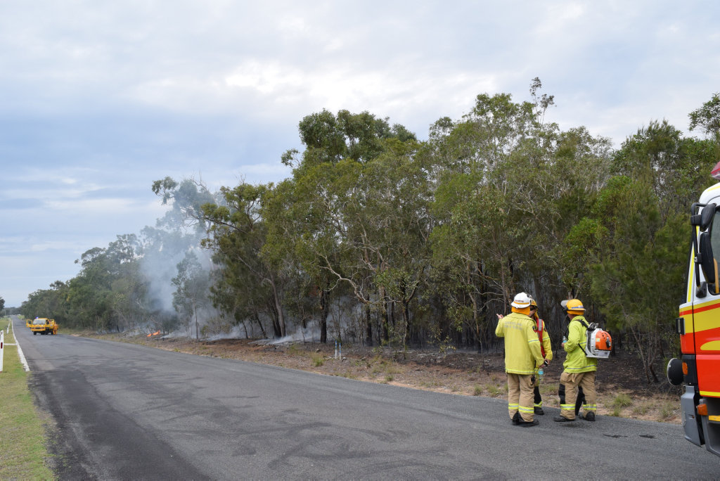 SUSPICIOUS: Torquay Fire Station officers and Booral Rural Fire Brigade volunteers put out the last flames at a scrub fire on Walkers Rd, Urangan. SUSPICIOUS: Torquay Fire Station officers and Booral Rural Fire Brigade volunteers put out the last flames at a scrub fire on Walkers Rd, Urangan.