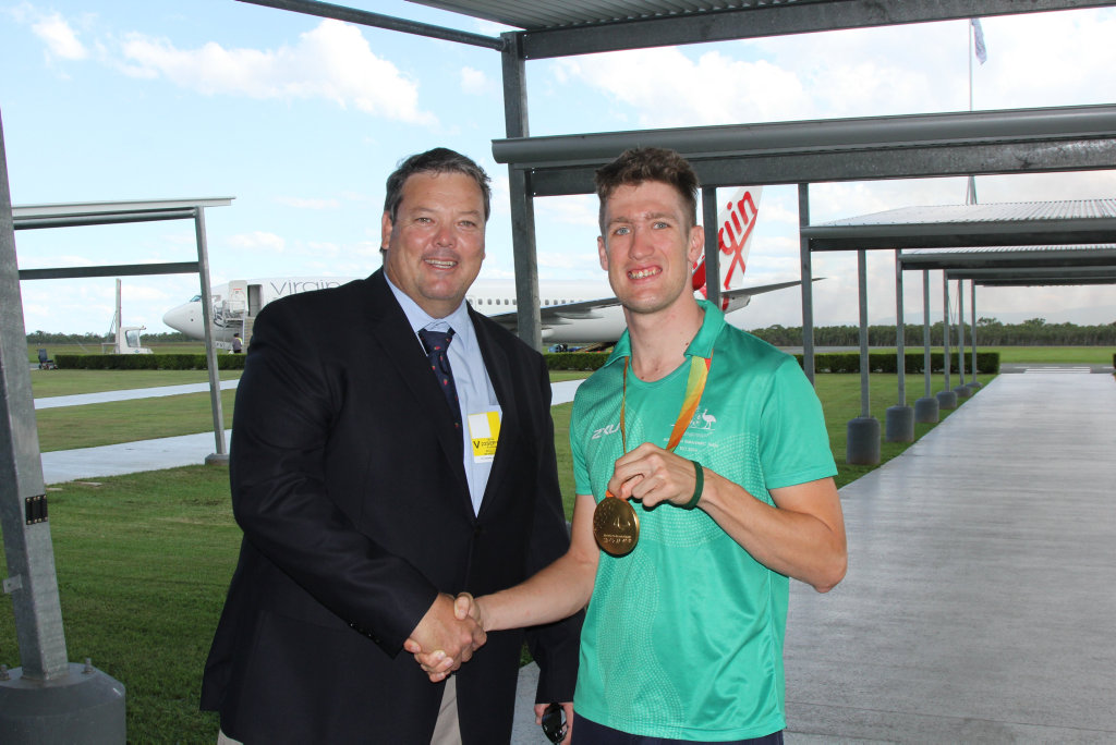 Gold medal winning paralympian David Nicholas with mayor Andrew Willcox at the Whitsunday Coast Airport this afternoon. Photo Peter Carruthers / Whitsunday Times