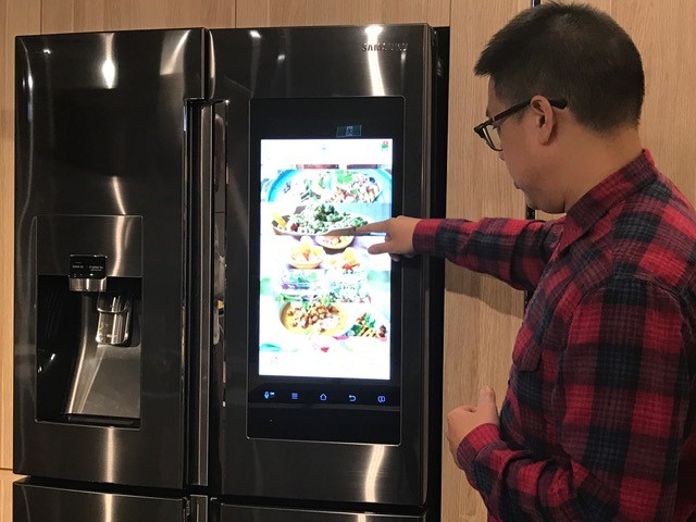 Chef Dan Hong checks out some of the 2200 recipes in the Samsung Family Hub fridge. Chef Dan Hong checks out some of the 2200 recipes in the Samsung Family Hub fridge.