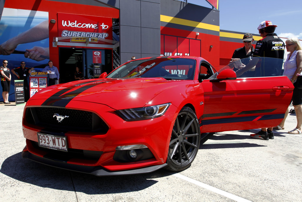 A Prodrive Racing-modified Ford Mustang GT was won by Mark Trembath of Mountain Creek as part of a Supercheap Auto and Castrol promotion. The prize was given to Mark at Supercheap Kawana by Supercars driver Chaz Mostert.Photo: Iain Curry A Prodrive Racing-modified Ford Mustang GT was won by Mark Trembath of Mountain Creek as part of a Supercheap Auto and Castrol promotion. The prize was given to Mark at Supercheap Kawana by Supercars driver Chaz Mostert.Photo: Iain Curry