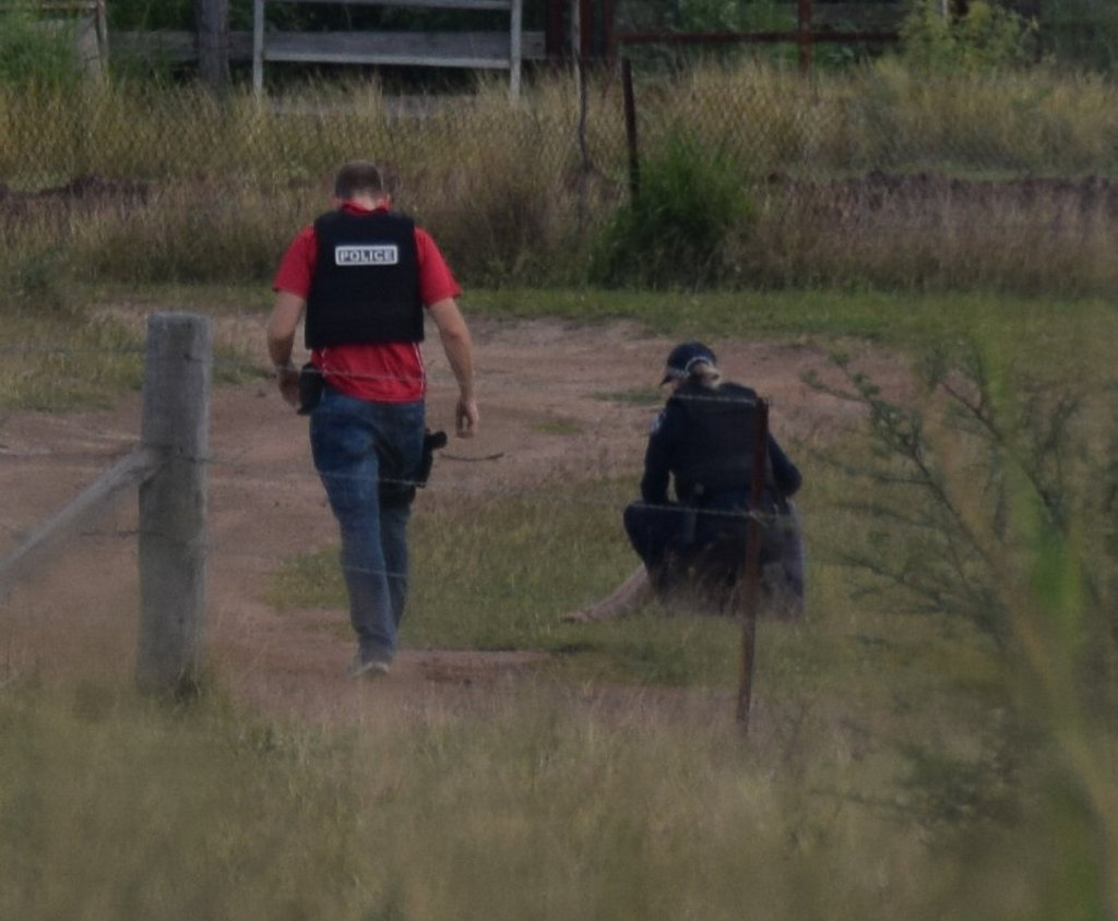 Police speak to the man who allegedly fired four shots at a Kabra property. Police speak to the man who allegedly fired four shots at a Kabra property.