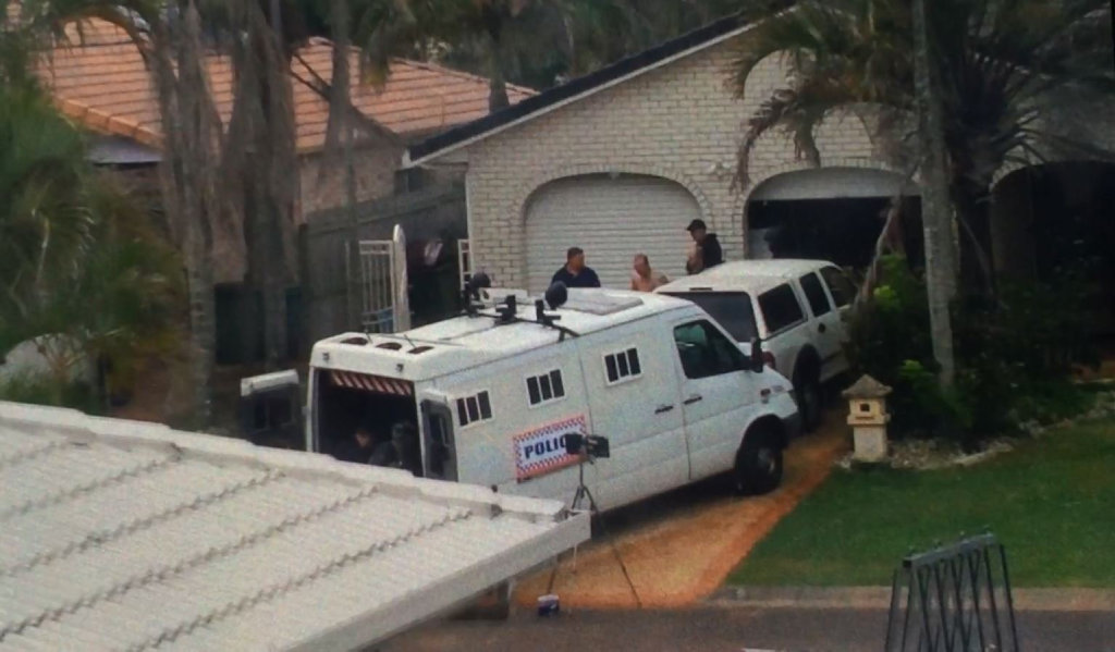 Police arrest a shirtless man after a stand-off at a Seafarer Ct home in Bokarina. Police arrest a shirtless man after a stand-off at a Seafarer Ct home in Bokarina.