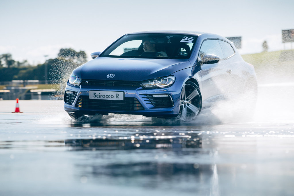 CONTROLLED SLIDE: VW's fun-packed Scirocco R is one of the performance cars you sample on the Volkswagen Driving Experience. CONTROLLED SLIDE: VW's fun-packed Scirocco R is one of the performance cars you sample on the Volkswagen Driving Experience.