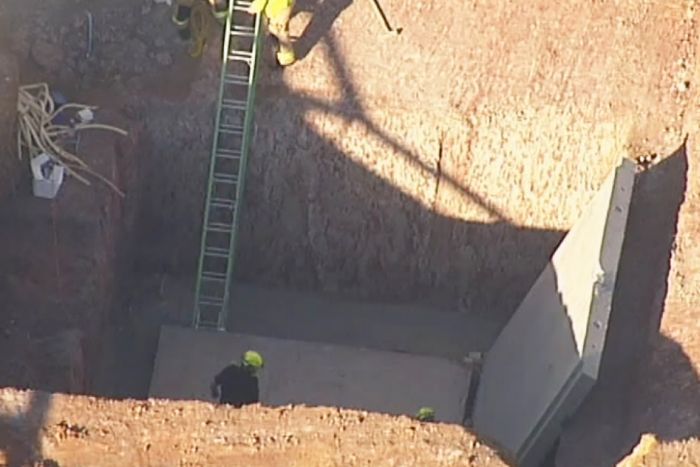 Two men were under a concrete slab when it fell on them. Image: ABC News Two men were under a concrete slab when it fell on them. Image: ABC News