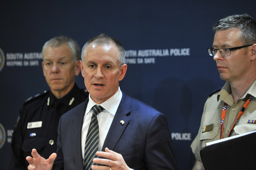 (L-R) Police Commissioner Grant Stevens, SA Premier Jay Weatherill and SA Emergency Chief Chris Beattie speak to the media during a press conference in Adelaide, Wednesday, Sept. 28, 2016. South Australia is coming back to life after severe weather damaged energy infrastructure, shutting down the entire electricity network and plunging the state into darkness. High winds are being blamed for bringing down at least 22 transmission towers in the mid-north on Wednesday with about 80,000 lightning strikes hitting the state, some damaging generation facilities. (AAP Image/David Mariuz) NO ARCHIVING (L-R) Police Commissioner Grant Stevens, SA Premier Jay Weatherill and SA Emergency Chief Chris Beattie speak to the media during a press conference in Adelaide, Wednesday, Sept. 28, 2016. South Australia is coming back to life after severe weather damaged energy infrastructure, shutting down the entire electricity network and plunging the state into darkness. High winds are being blamed for bringing down at least 22 transmission towers in the mid-north on Wednesday with about 80,000 lightning strikes hitting the state, some damaging generation facilities. (AAP Image/David Mariuz) NO ARCHIVING