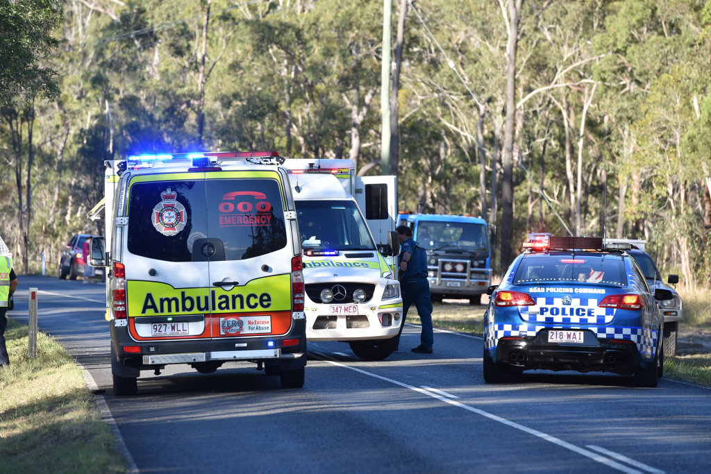 Emergency workers at the scene of a fatal accident on Old Toogoom Rd. near the Beelbi Creek causeway. Emergency workers at the scene of a fatal accident on Old Toogoom Rd. near the Beelbi Creek causeway.