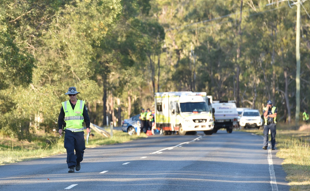 Police crash investigators inspect Old Toogoom Rd at the scene of a fatal accident. Police crash investigators inspect Old Toogoom Rd at the scene of a fatal accident.