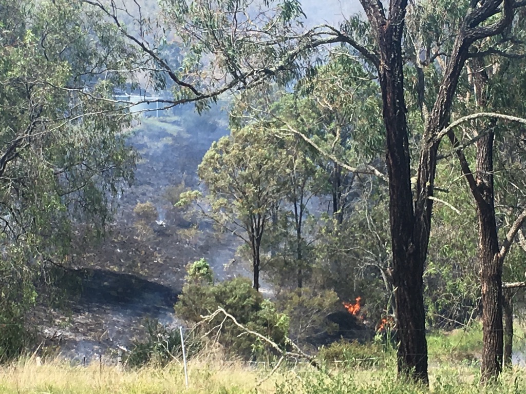 A fast-moving grass fire threatened a house in the Lockyer Valley. A fast-moving grass fire threatened a house in the Lockyer Valley.