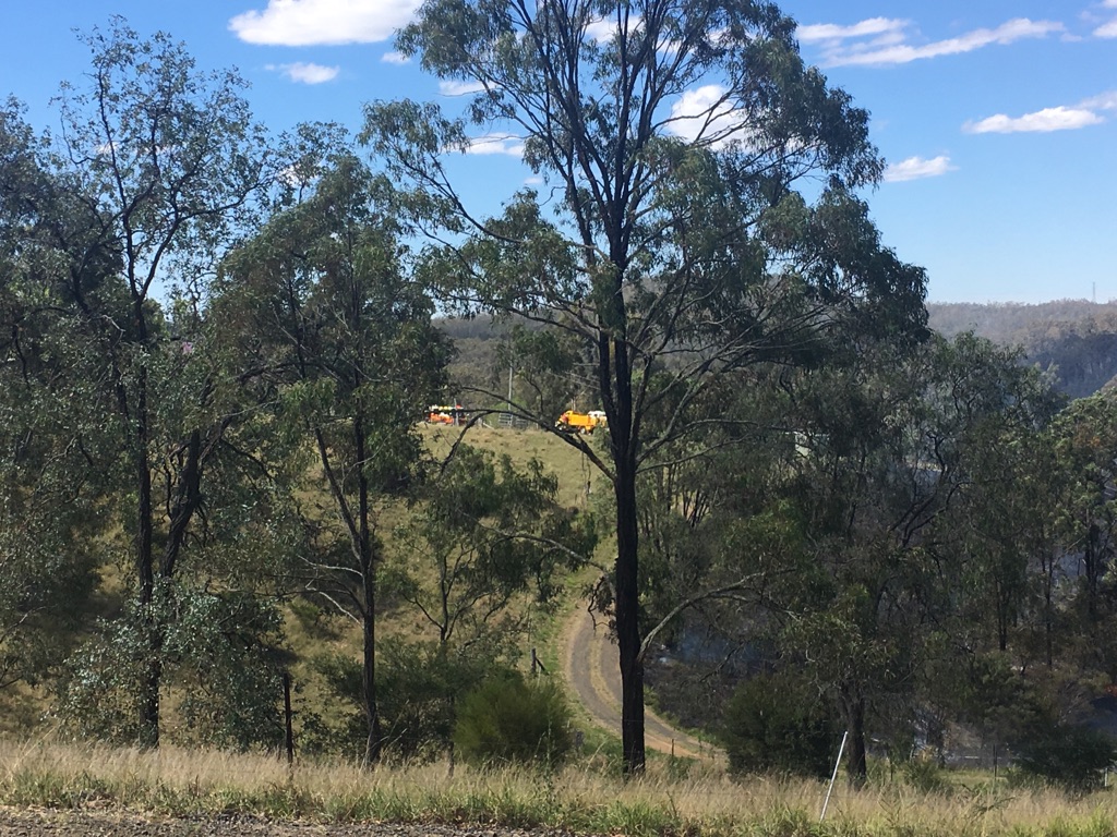 A fast-moving grass fire threatened a house in the Lockyer Valley. A fast-moving grass fire threatened a house in the Lockyer Valley.