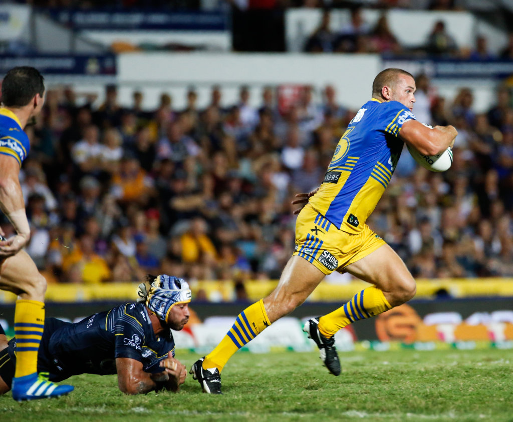 Eels Danny Wicks makes a break from the tackle of Cowboys co-captain Johnathan Thurston during the round 8 NRL match between the North Queensland Cowboys and the Parramatta Eels at 1300 Smiles Stadium in Townsville, Saturday, April 23, 2016. Eels Danny Wicks makes a break from the tackle of Cowboys co-captain Johnathan Thurston during the round 8 NRL match between the North Queensland Cowboys and the Parramatta Eels at 1300 Smiles Stadium in Townsville, Saturday, April 23, 2016.