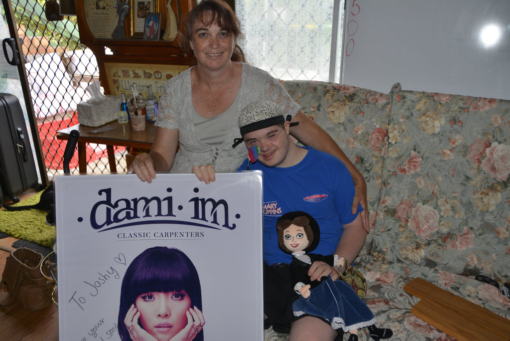 Toni Mitchell and Joshy Mitchell with Joshy's bucket list. Toni Mitchell and Joshy Mitchell with Joshy's bucket list.