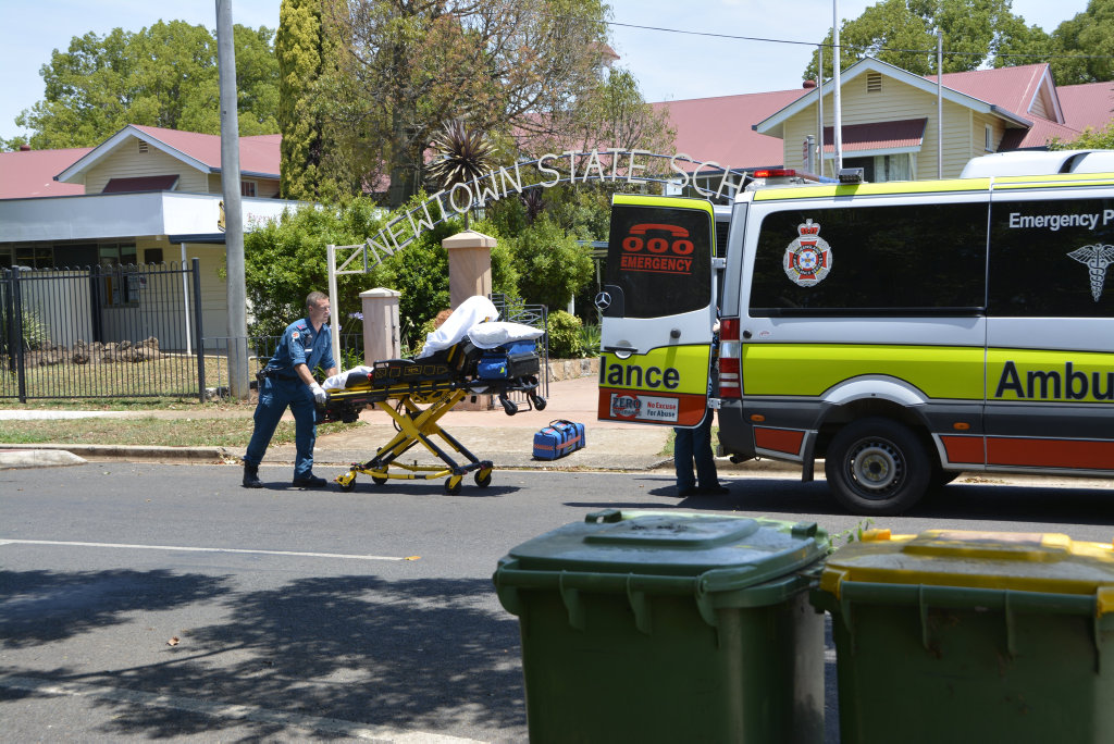 Paradmedics transport a male student from Newtown State School after a near drowning. Paradmedics transport a male student from Newtown State School after a near drowning.