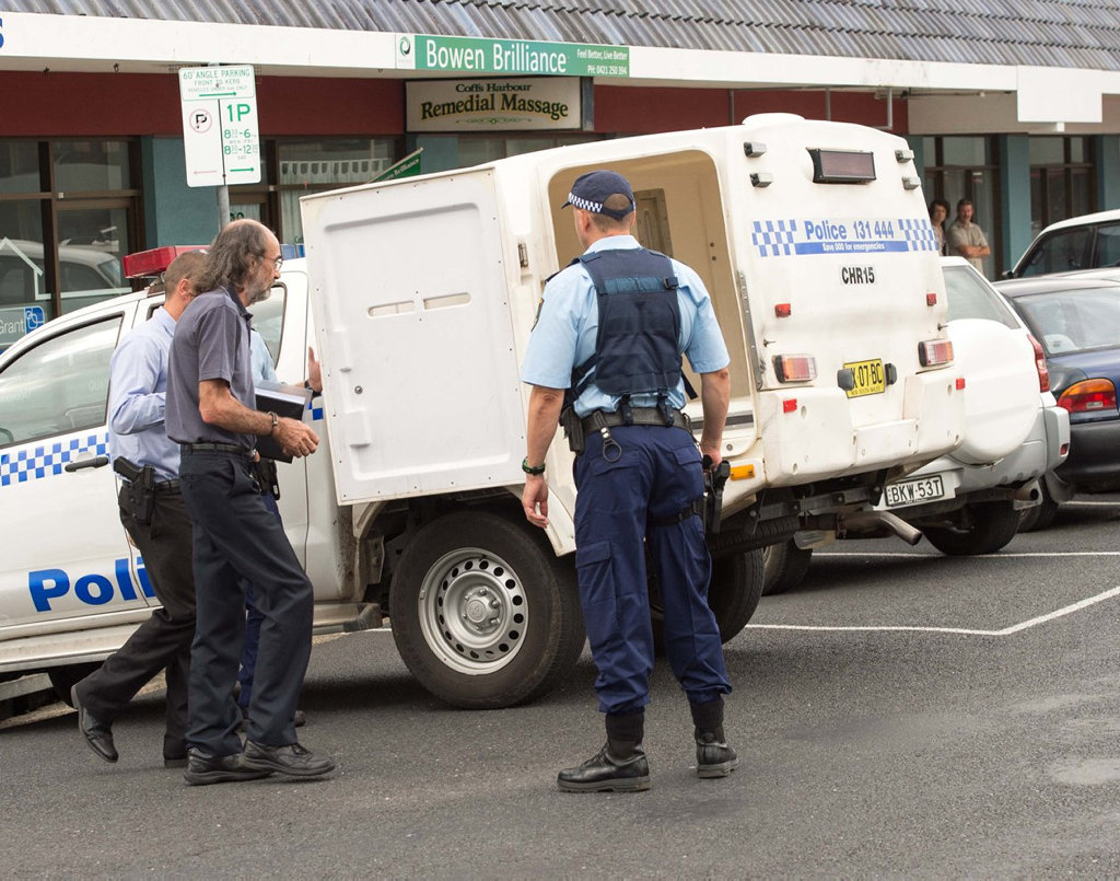 Timothy Moffatt is arrested by police outside the Coffs Harbour massage parlour in 2014.
Timothy Moffatt is arrested by police outside the Coffs Harbour massage parlour in 2014.