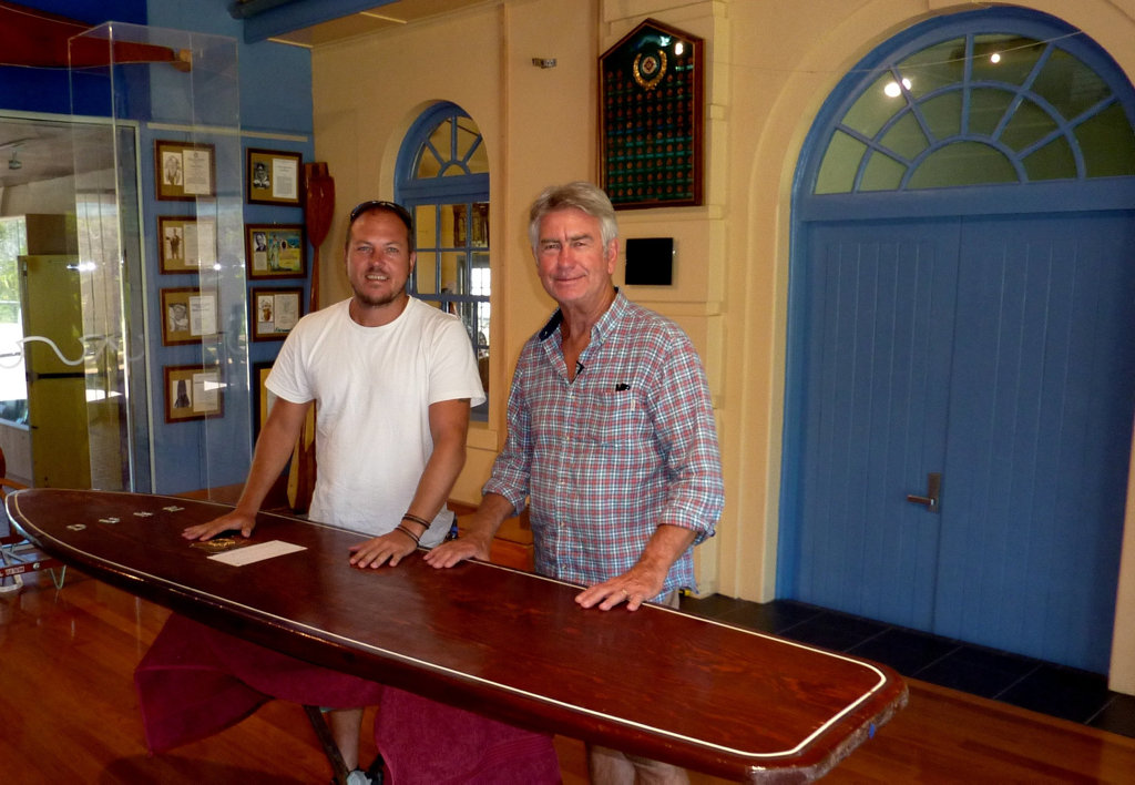 Filmmakers Shaun Cairns and Phil Jarratt pictured with a traditional Hawaiian wooden surfboard. The men have produced the Australian surfing documentary Men of Wood & Foam for the History Channel. Filmmakers Shaun Cairns and Phil Jarratt pictured with a traditional Hawaiian wooden surfboard. The men have produced the Australian surfing documentary Men of Wood & Foam for the History Channel.