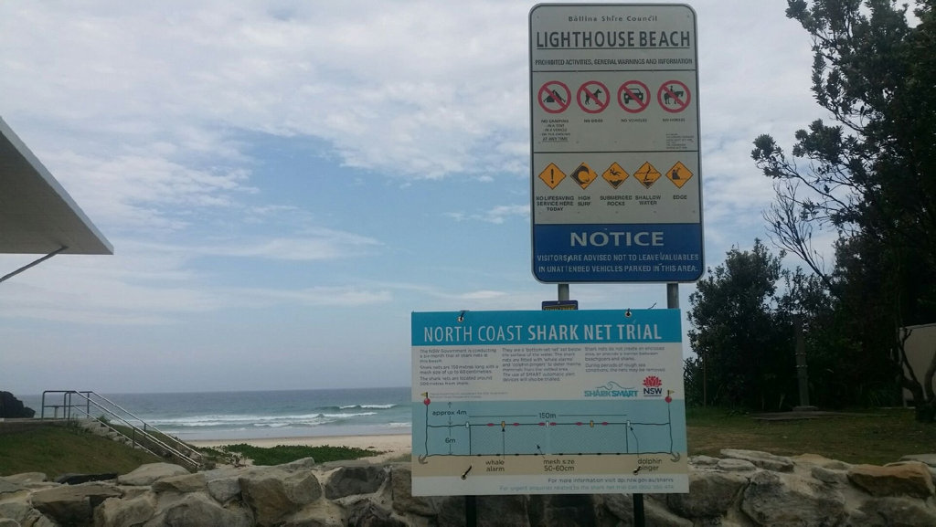 A sign at Lighthouse Beach, Ballina, advising of the shark net trial. A sign at Lighthouse Beach, Ballina, advising of the shark net trial.