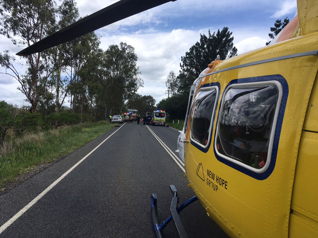 RACQ LifeFlight Rescue crews at the scene of a motorcycle crash on Sunday. RACQ LifeFlight Rescue crews at the scene of a motorcycle crash on Sunday.
