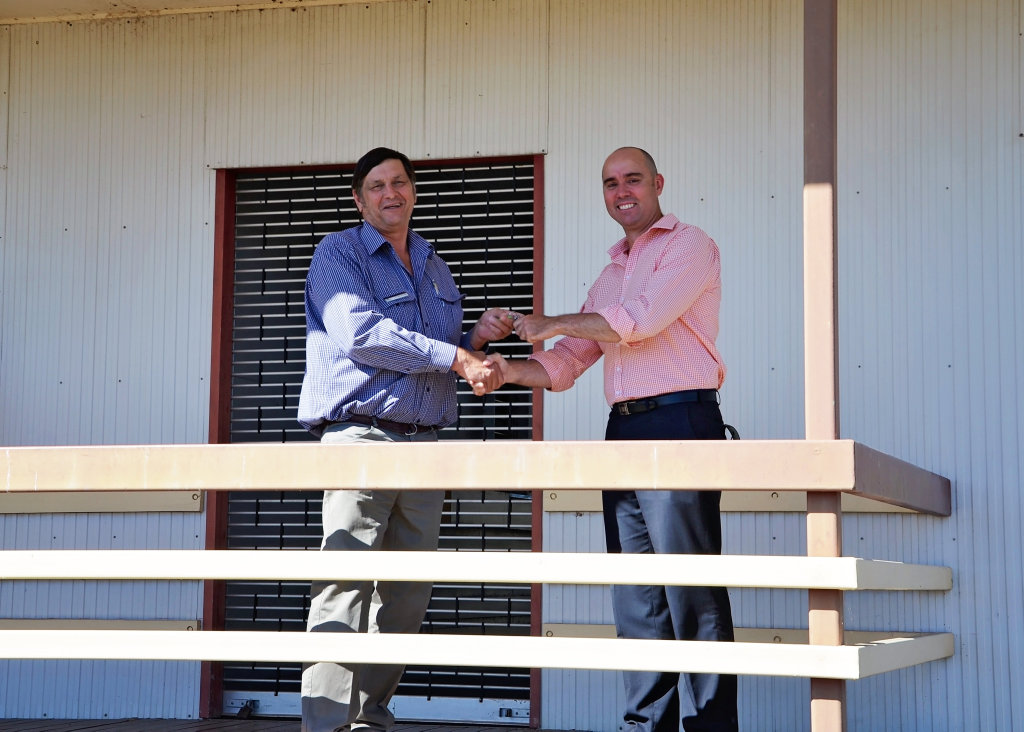 Banana Shire Mayor Nev Ferrier receives the keys to the old Biloela Railway station house from Queensland Transport manager of rail corridor management Craig England.Photo contributed