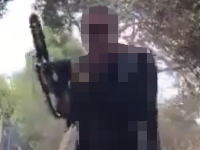 A still from the man’s alleged video terrorist propaganda. A still from the man’s alleged video terrorist propaganda.