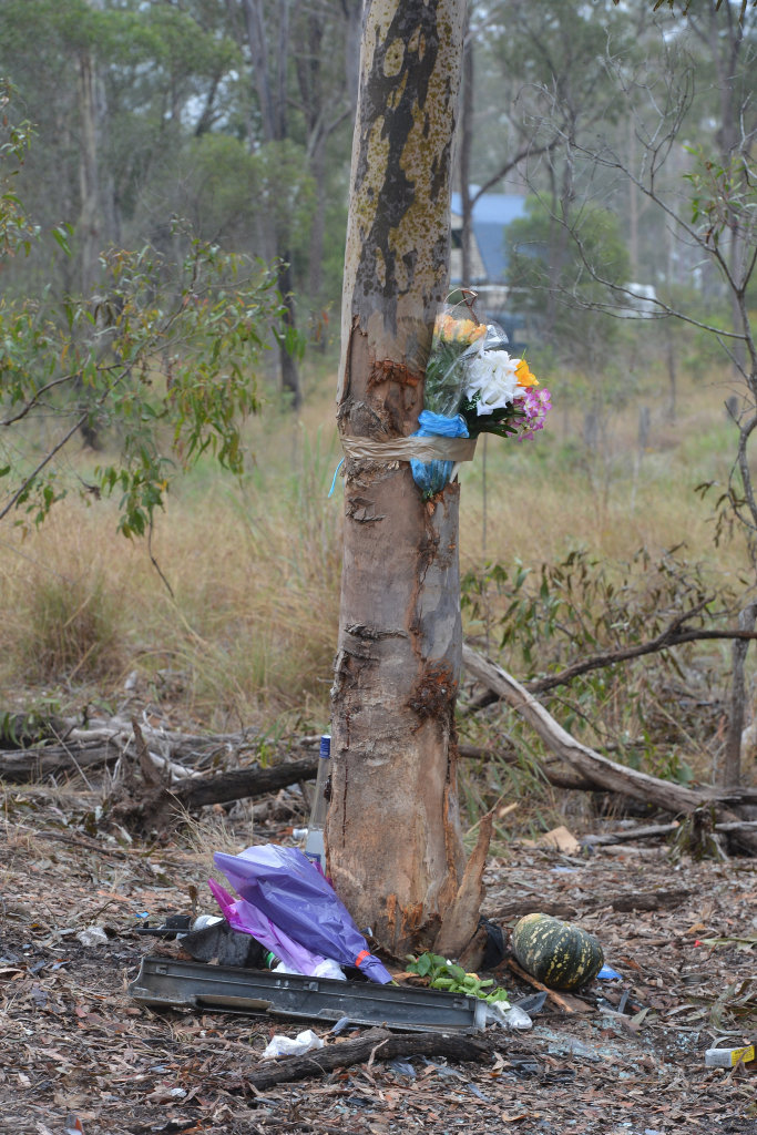 TRIBUTES LAID: Flowers are taped to the tree at the scene of a tragic crash in Bucca. TRIBUTES LAID: Flowers are taped to the tree at the scene of a tragic crash in Bucca.