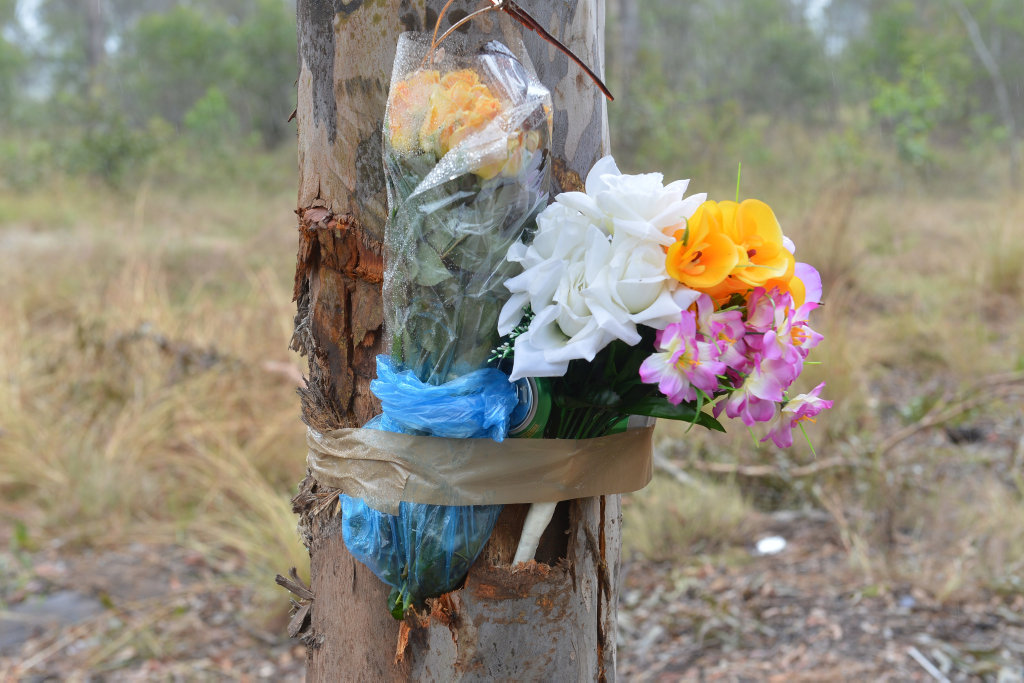TRIBUTES LAID: Flowers are taped to the tree at the scene of a tragic crash in Bucca. TRIBUTES LAID: Flowers are taped to the tree at the scene of a tragic crash in Bucca.