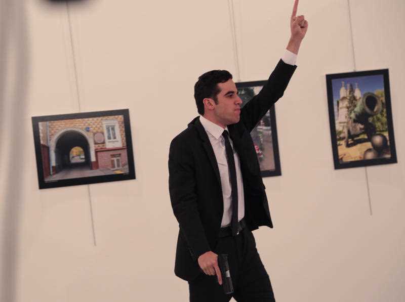 The gunman gestures after shooting the Russian Ambassador, Andrei Karlov. The gunman gestures after shooting the Russian Ambassador, Andrei Karlov.