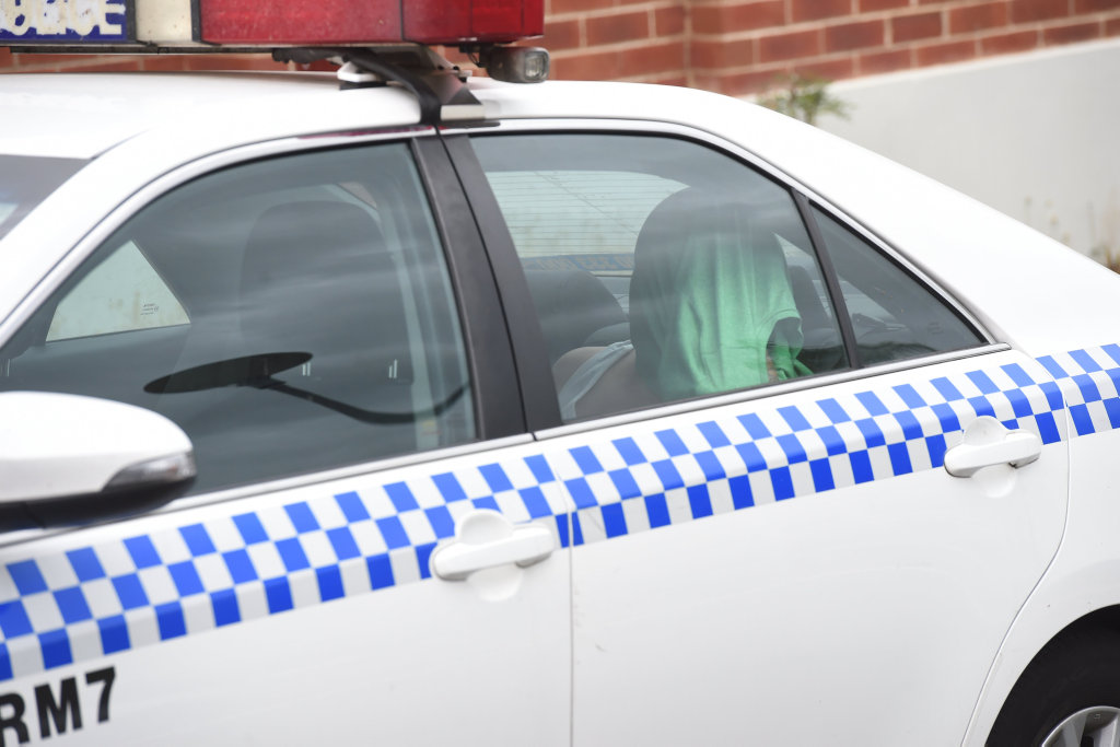 Arriving at Lismore Police Station in a police vehicle. Arriving at Lismore Police Station in a police vehicle.