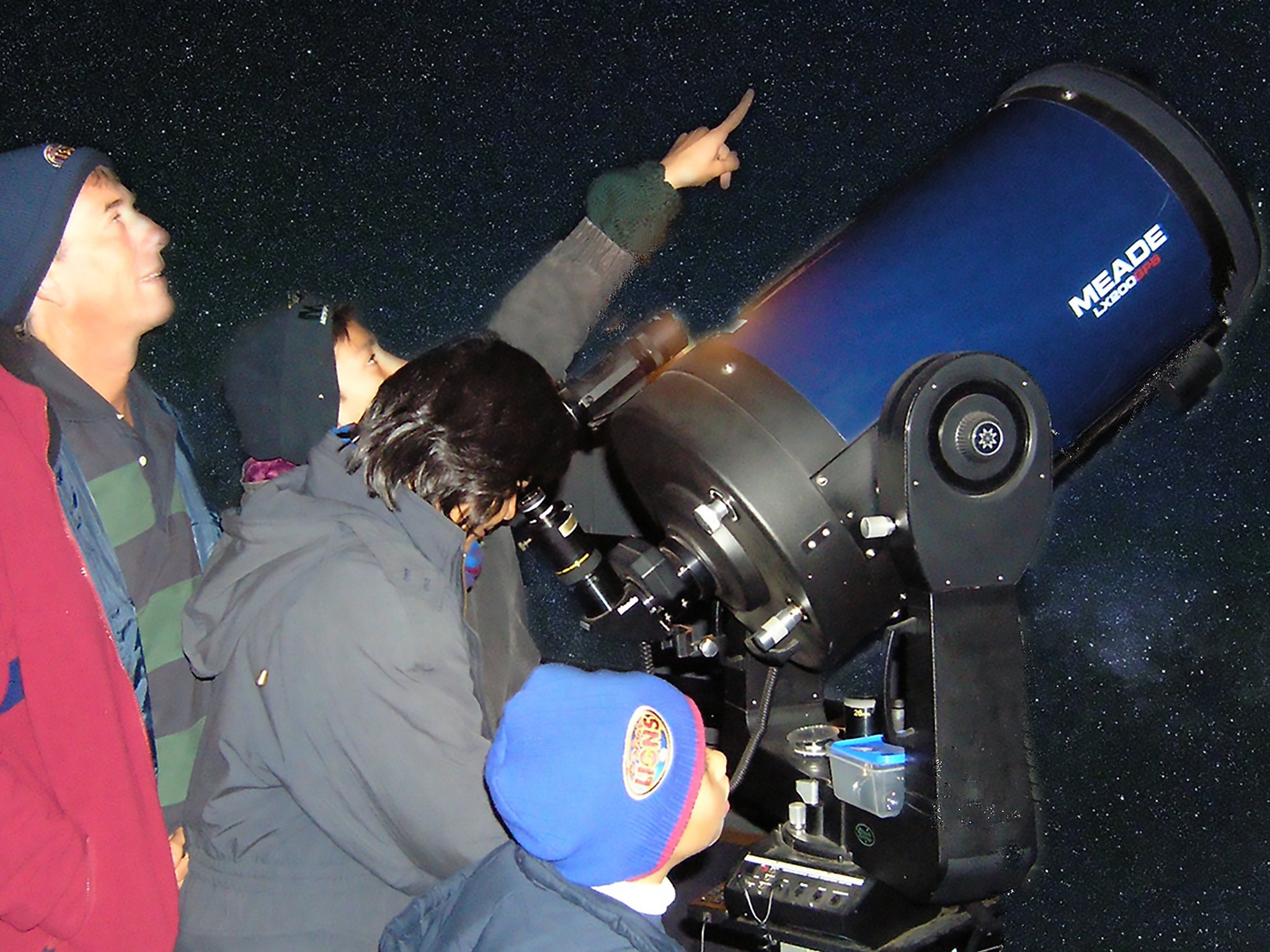 Visitors to the Kingaroy Observatory look at the night sky. Visitors to the Kingaroy Observatory look at the night sky.