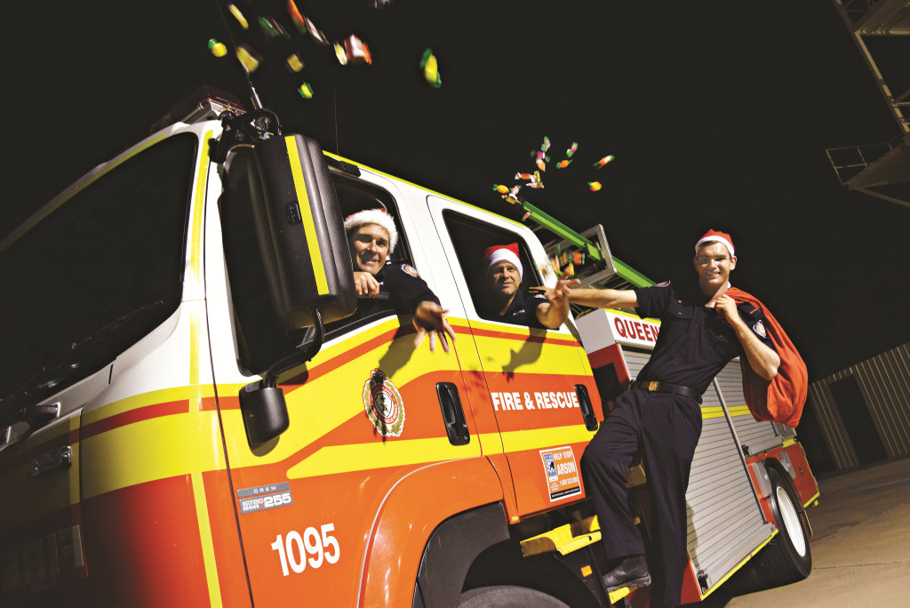 SPECIAL DELIVERY: Firefighters Arthur Sorrensen, Richard Dippel and Samuel Kessler are ready for the annual Biloela Lolly Drop on Christmas Eve.