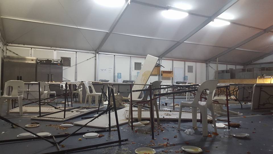Behrouz Boochani shared this image on Facebook of upturned tables in the Manus Island detention centre on Christmas Eve. Behrouz Boochani shared this image on Facebook of upturned tables in the Manus Island detention centre on Christmas Eve.
