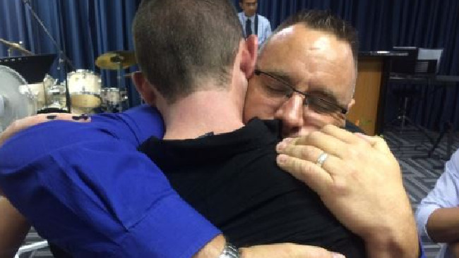 Karl Sisson embraces Adrian Murray this week. Karl Sisson embraces Adrian Murray this week.