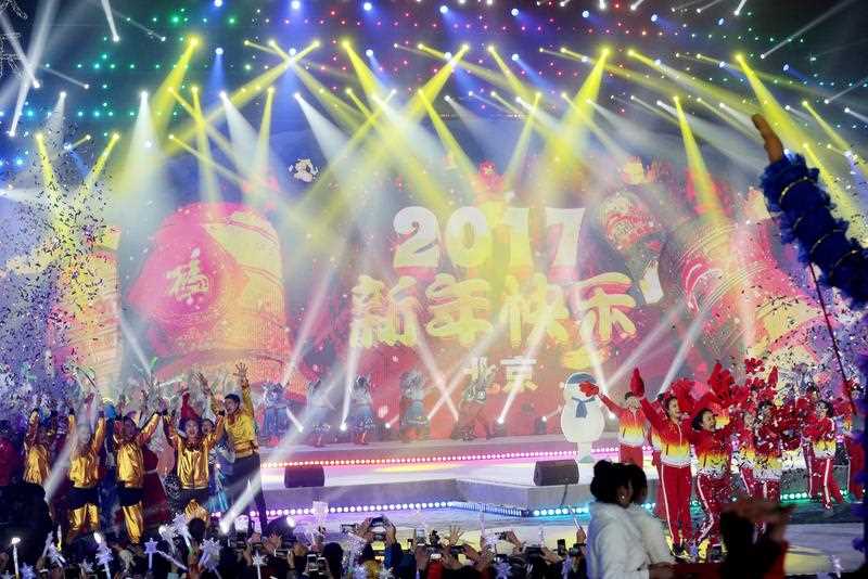 Performers celebrate during the count down event to celebrate the arrival of the 2017 during New Year's Eve celebration at Beijing Olympic Park in Beijing city, China, 01 January 2017. Performers celebrate during the count down event to celebrate the arrival of the 2017 during New Year's Eve celebration at Beijing Olympic Park in Beijing city, China, 01 January 2017.