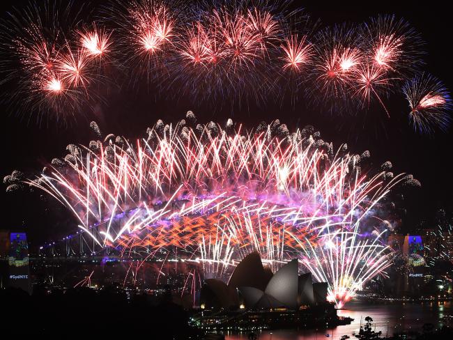 Sydney’s New Year’s Eve midnight fireworks spectacular from a rooftop in Potts Point. Sydney’s New Year’s Eve midnight fireworks spectacular from a rooftop in Potts Point.