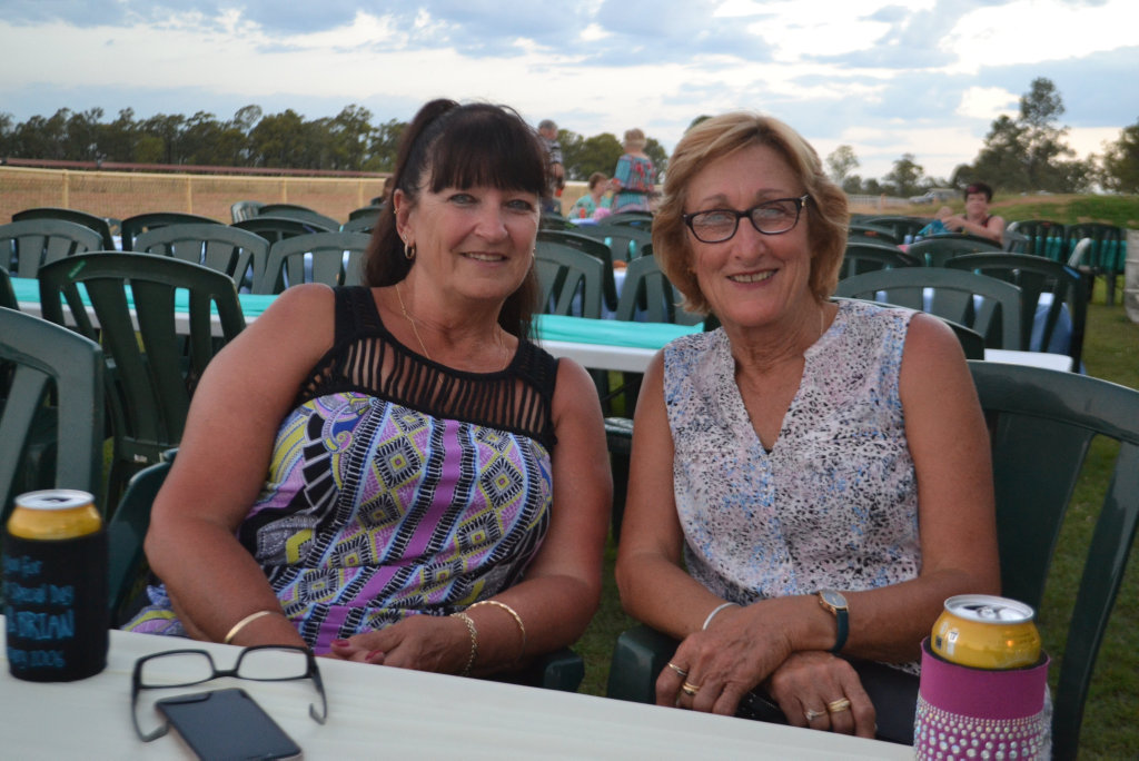 Image for sale: Travelling friends Dawn Fox and Lorraine King from Western Australia at the Miles New Years Eve beach party celebrations. 31/12/16.