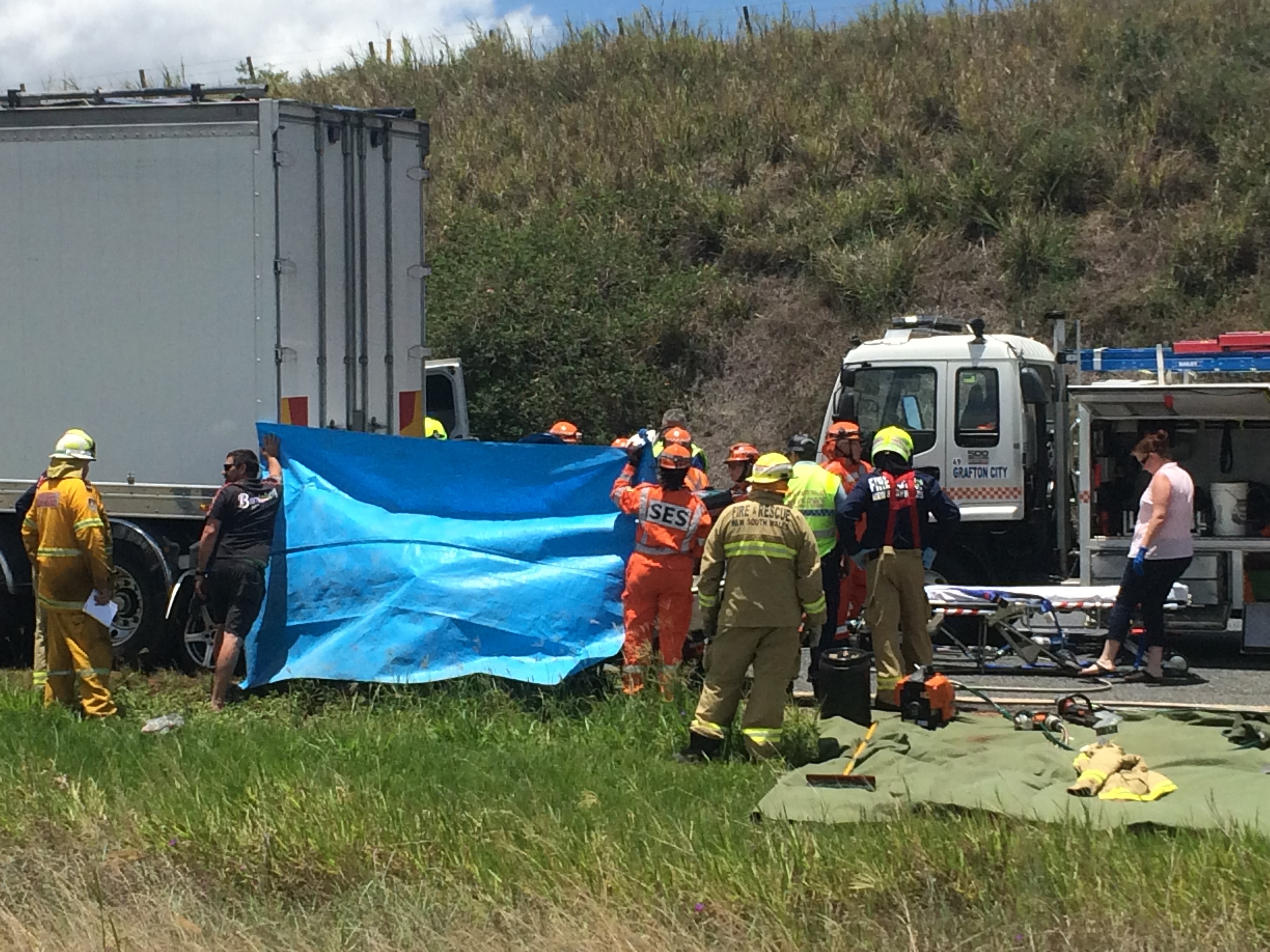 Emergency services are trying to release the driver of a car that has crashed into the back of a semi-trailer on the Pacific Highway at Clarenza. Emergency services are trying to release the driver of a car that has crashed into the back of a semi-trailer on the Pacific Highway at Clarenza.