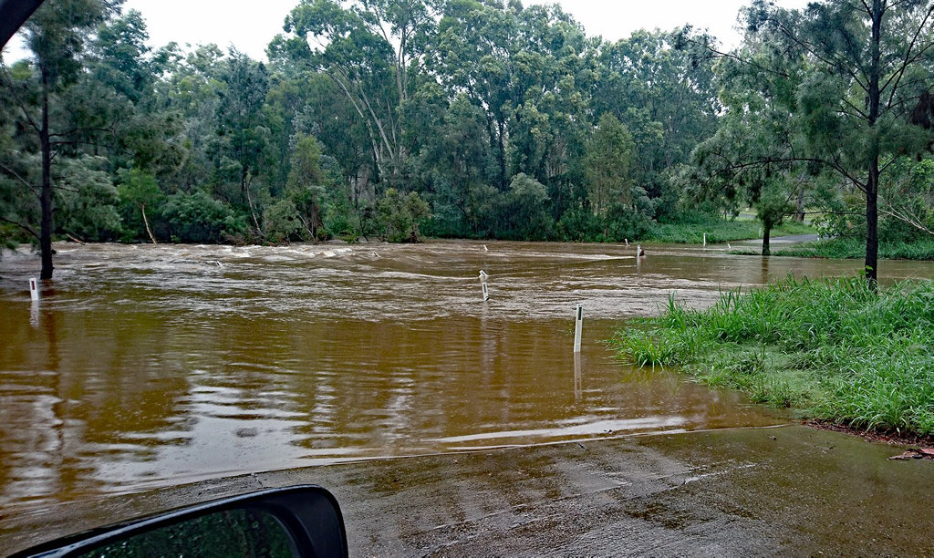 Fast flowing and dangerous: Nebo Creek is two metres over the road on Bowen Street, Nebo. Fast flowing and dangerous: Nebo Creek is two metres over the road on Bowen Street, Nebo.