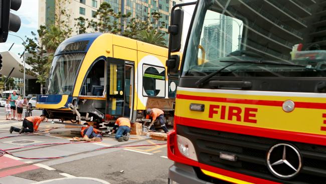 A Gold Coast tram was knocked off its tracks following a collision with a fire truck on the corner of Surfers Paradise Blvd and Hamilton Ave early on Sunday morning. A Gold Coast tram was knocked off its tracks following a collision with a fire truck on the corner of Surfers Paradise Blvd and Hamilton Ave early on Sunday morning.