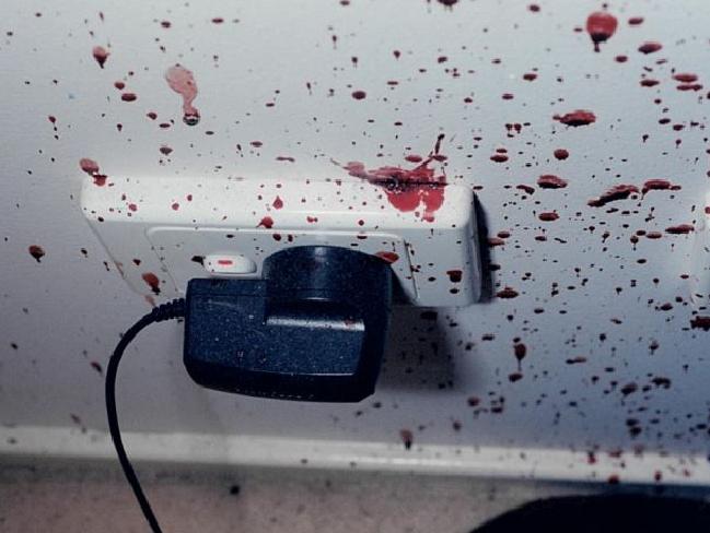 The mobile phone charger and bedroom wall was covered in blood. The mobile phone charger and bedroom wall was covered in blood.