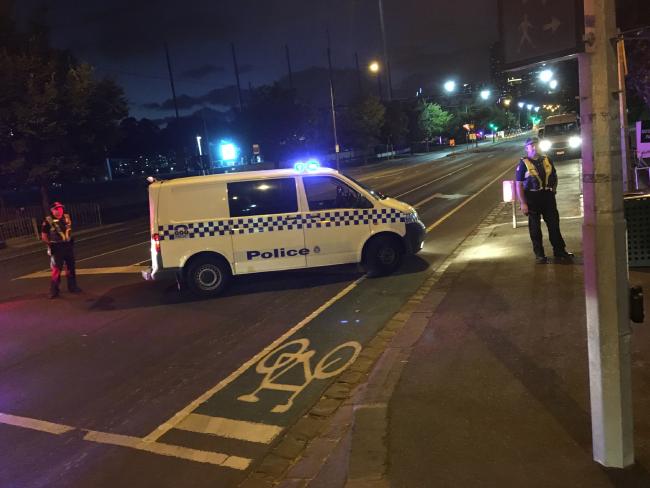 Police man the roadblock outside Melbourne Park. Police man the roadblock outside Melbourne Park.