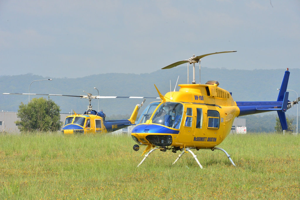 Two helicopters are on stand-by at Coolum in Research St as firefighters continue to fight the bushfire that threatened homes overnight, but has this morning been contained. Two helicopters are on stand-by at Coolum in Research St as firefighters continue to fight the bushfire that threatened homes overnight, but has this morning been contained.