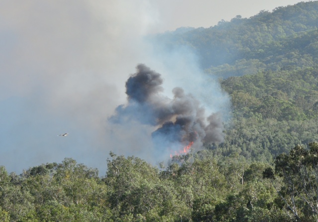 Dark smoke rises from the blaze Dark smoke rises from the blaze
