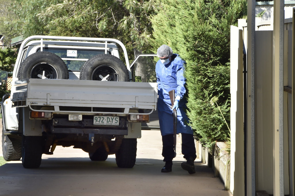 SHOTS FIRED: A Police SOC officer removes a fire arm from a ute in the driveway of a Rudd St home. A crime scene has been declared at Rudd St, Drayton after shots were fired this morning. SHOTS FIRED: A Police SOC officer removes a fire arm from a ute in the driveway of a Rudd St home. A crime scene has been declared at Rudd St, Drayton after shots were fired this morning.