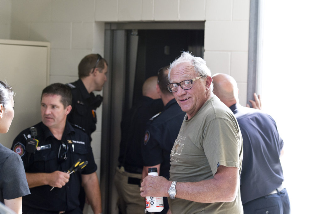 Firefighters free John Quade after he was trapped in a lift at the Blood Bank for an hour. Firefighters free John Quade after he was trapped in a lift at the Blood Bank for an hour.