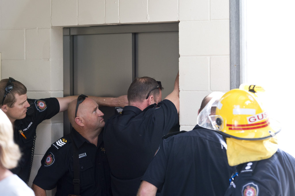 Firefighters work to free John Quade after he was trapped in a lift at the Blood Bank for an hour. Firefighters work to free John Quade after he was trapped in a lift at the Blood Bank for an hour.