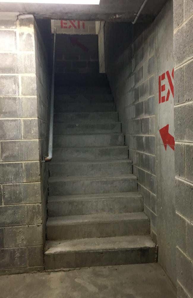 The body of 71-year-old Bernard Gore lay undiscovered in the Westfield Bondi Junction stairwell (above) for three weeks after he disappeared from the level four shops. The body of 71-year-old Bernard Gore lay undiscovered in the Westfield Bondi Junction stairwell (above) for three weeks after he disappeared from the level four shops.