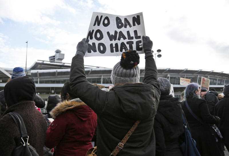 President Donald Trump's immigration order sowed more chaos and outrage across the country Sunday, with travelers detained at airports, panicked families searching for relatives and protesters registering opposition to the sweeping measure that was blocked by several federal courts. President Donald Trump's immigration order sowed more chaos and outrage across the country Sunday, with travelers detained at airports, panicked families searching for relatives and protesters registering opposition to the sweeping measure that was blocked by several federal courts.