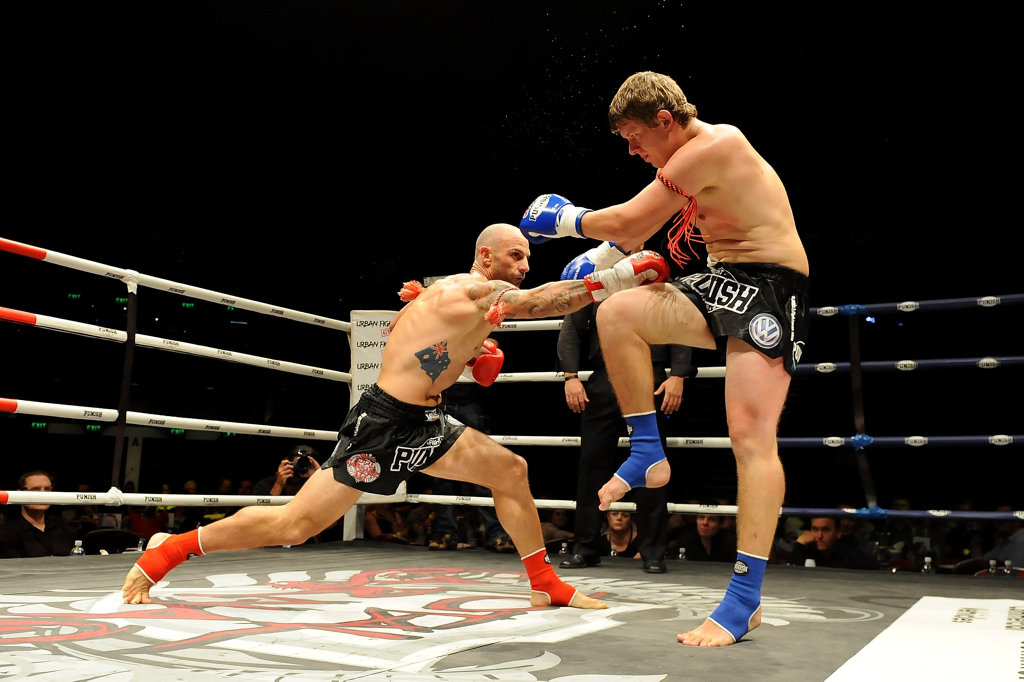 GOLD COAST, AUSTRALIA - MARCH 09: Mark Lucchiari (L) punches Jack McInnes in their bout during Total Carnage III at Gold Coast Convention and Exhibition Centre on March 9, 2013 in Gold Coast, Australia. (Photo by Matt Roberts/Getty Images)