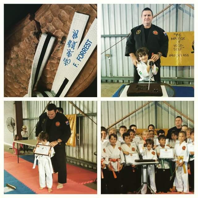 Fergus being awarded his black belt by Sensei Allan Wardell